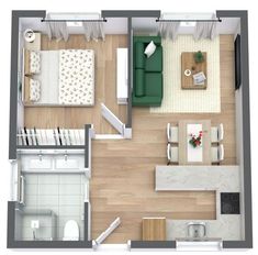 an overhead view of a living room and kitchen in a small apartment with wood flooring