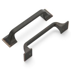 an image of two handles on a white background, one is black and the other is bronze