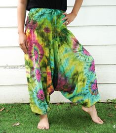 "💥One Size Fits Most Comfortable Low Cut Drop Crotch Tie Dye Harem Pants, Hippie Pants, Tie Dye Baggy Pants, Festival Harem Pants, Festival Clothing, Tye Dye Genie Pants, Tie Dye Comfy Pants 👉Fabric: Soft and Breathable Rayon 👉Smocked Elasticated Waist: 26\" up to 54\" 👉Hips up to: 60\" 👉Total Length: 39\" (Top to Bottom) 👉 Around elastic ankle 10\" 👉 Tie Dye Method 👉 One Size Fits M-XL or US 2-20 👉Extremely Comfortable 👉Boho/Hippie Theme, Beach Wear/Festival Going Pants Note: Due to t Green Hippie Harem Pants For Summer, Summer Cotton Harem Pants, Hippie Relaxed Fit Harem Pants For Summer, Summer Hippie Relaxed Fit Harem Pants, Green Summer Parachute Pants, Summer Green Parachute Pants With Loosely Fitted Hips, Green Baggy Hippie Bottoms, Baggy Green Parachute Pants For Summer, Relaxed Fit Harem Pants For Summer Festivals