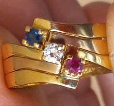 Here is a fun set of stacking bands in Retro style.  Three bands of marked 18k yellow gold.  Each has a diamond, ruby or blue sapphire gemstone of about .08 carat weight.  The natural gemstones are small but fine quality.  The finger size measures 5-5.5 on my mandrel, see the photograph.  These three lightweight rings weigh 3.9 grams.  They fit nicely together and can be worn single, double or triple in any arrangement. Blue Sapphire Gemstone, Stacking Bands, Ruby Sapphire, Multi Stone Ring, Sapphire Gemstone, Multi Stone, Stacking Rings, Newport, Stone Rings