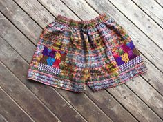 "Vintage pull-on handwoven shorts from Guatemala Drawstring highwaist, 100 cotton, cute front patch pockets. Marked size XL; I assume this is a kids size but these are from the era of everything being super oversized. In my opinion they would fit up to a generous adult small, maybe a medium. Excellent vintage condition, normal light wear with no significant flaws noted. The drawstring is slightly worn but still in good usable condition. Elastic is still very stretchy. A couple minor loose thread Cotton Patchwork Shorts For Vacation, Patchwork Cotton Shorts For Vacation, Multicolor Shorts With Pockets For Festivals, Bohemian Style Relaxed Fit Shorts, Bohemian Relaxed Fit Shorts, Bohemian Shorts With Elastic Waistband And Relaxed Fit, Bohemian Style Relaxed Fit Shorts With Elastic Waistband, Bohemian Relaxed Fit Shorts With Elastic Waistband, Bohemian Cotton Shorts With Relaxed Fit