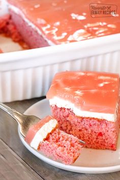 a piece of red velvet cake on a plate with a fork next to the cake