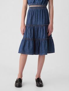 Soft denim midi skirt.  Elasticized waist.  Tiered skirt.  Responsibly Made: This denim skirt is part of our water-saving Washwell program.  Compared with conventional wash methods, Washwell uses at least 20% less water and has saved over a billion liters of water since 2016.  This product was made in a factory that invests in gender equality and women’s empowerment.  Through RISE Reimagining Industry to Support Equality) and Gap Inc. ’s program P. A. C. E.  Personal Advancement & Career Enhance Fashion 2025, Gender Equality, Support People, Water Saving, Denim Midi Skirt, Gap Kids, Tier Skirt, Tiered Skirt, Dress With Cardigan