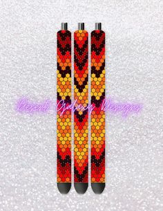 two orange and black sticks with hearts on them