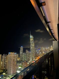 the city skyline is lit up at night