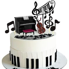 a cake decorated with musical notes and a piano