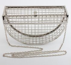 Shape: Rectangle and Half Moon Handbags Type: Shoulder Bags Types of bags: Handbags & Crossbody bags Main Material: Metallic Closure Type: Hasp Hardness: HARD Exterior: Solid Bag Pattern Type: Solid Number of Handles/Straps: Single Decoration: Hollow Out Decoration: Chains Main Material: metal Silver Rectangular Clutch For Shopping, Silver Rectangular Clutch For Daily Use, Silver Rectangular Evening Bag For Travel, Cage Bag, Catalog Bag, Metallic Handbags, Party Clutch, Cross Chain, Chain Crossbody Bag