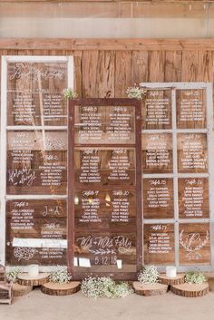 the wedding seating is set up in front of an old window and wooden paneled wall