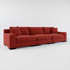 a red couch with pillows sitting on it's back end and the seat up