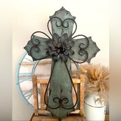 a wooden cross sitting on top of a table