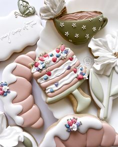 some decorated cookies are laying on a table