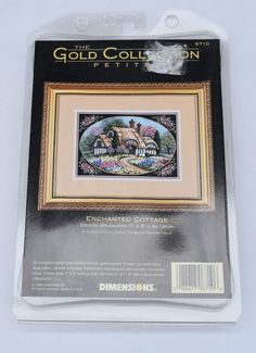 the cross stitch kit is in its package with instructions to make it look like an old house