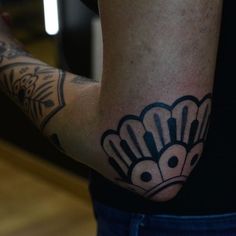 a person with a tattoo on their arm