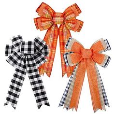 three orange and black bows with gingham checkers on each bow, one in the