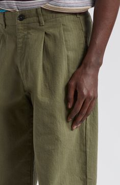 Japanese cotton in a herringbone weave adds to the premium comfort and lasting wear of these pleat-front pants that epitomize casual ease. 31 1/2" inseam; 17" leg opening; 11 1/2" front rise; 15 1/2" back rise (size 32) Zip fly with button closure Side-seam pockets; back button-welt pockets 100% cotton Machine wash, tumble dry Made in Portugal Designer Clothing Cotton Pleated Straight Pants, Pleated Cotton Straight Pants, Relaxed Fit Tapered Bottoms With Belt Loops, Spring Tapered Pants With Belt Loops, Relaxed Fit Trousers With Pleated Waist, Cotton Wide Leg Bottoms With Pleated Waist, Classic Tapered Bottoms For Spring, Relaxed Fit Straight Pants With Pleated Waist, Solid Cotton Bottoms With Pleated Waist