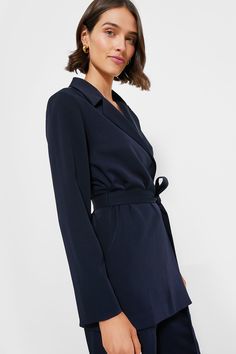 Polished and chic, the Navy Octavia Wrap Blazer comes with a chic self-tie waist, lapel collar, and longer hem, this number is a necessity. Pair it with the matching Navy Erin pants for a summer power suit moment, or with a mini skirt and heels for drinks and dinner. Lapel collar Long sleeves Removable self-tie belt (included) Straight hem Lined Material: 96% Polyester, 4% Spandex (body), 97% Polyester, 3% Spandex Care: Machine wash cold and gentle, tumble dry low, iron low Wrap Blazer, Hamptons Summer, Summer Style Guide, Plus And Minus, Power Suit, Cocktail Attire, The Navy, Low Iron, Pullover Sweatshirts