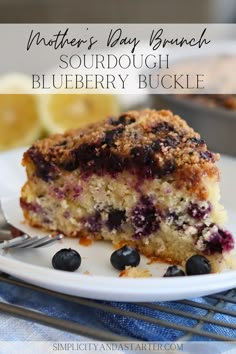 a close up of a slice of blueberry crumb cake on a plate with a fork