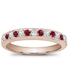 This pave-set wedding band features seven diamonds totaling 0.20ct, six round cut ruby's, and has milgrain edges. This setting is available in white or yellow gold and platinum. Ruby And Diamond Wedding Band, Classic Red Diamond Ring With Pave Setting, Classic Half Eternity Ruby Ring, Classic Ruby Ring With Pave Setting For Anniversary, Classic Ruby Ring With Pave Setting For Wedding, Ring Redesign, Redesign Ideas, Fantasy Au, Ruby Wedding Band