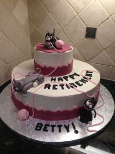 a three tiered cake decorated with cats and mouses on the top, says happy retirement betty