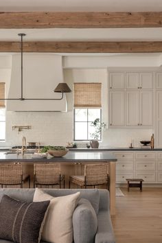 a living room and kitchen area with couches