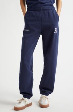 Luxurious in comfort, these cotton sweatpants are always ready to relax and rep the New York Yankees with logo embroidery. 29" inseam; 11" leg opening; 12 1/4" front rise; 16" back rise (size Medium) Elastic waist Side-seam pockets 100% cotton Machine wash, tumble dry Made in Portugal Asian & Pacific Islander Owned/Founded Cotton Sweatpants With Straight Hem, Sporty Cotton Sweatpants For Streetwear, Cotton Joggers With Ribbed Waistband For Streetwear, Cotton Sweats With Elastic Waistband For Streetwear, Cotton Sweatpants With Letter Print For Streetwear, Sporty Cotton Joggers For Streetwear, Cotton Joggers With Straight Hem, Leisure Cotton Pants With Straight Hem, Cotton Sweats With Comfort Waistband For Streetwear