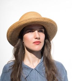 "Paz" is the ideal summer hat for you. A wide hat brim shields off too much sun, while the tall bowler shape sits perfectly even with a light sea breeze. The simple straw hat makes for a cool look on hot days. Made of antique Florentine straw, a rarity from the '60s, the summer hat is an ideal companion for trips to the summer resort. Lightweight and flexible, it offers the highest wearing comfort. Available in sizes 56 cm - 59 cm. Colour "wheat" Hat made of antique Florentine straw Grosgrain ri Elegant Brimmed Straw Sun Hat, Elegant Straw Sun Hat, Summer Curved Brim Boater Hat For Picnic, Summer Picnic Boater Hat With Curved Brim, Elegant Natural Boater Hat For Garden Party, Elegant Natural Panama Hat For Spring, Beige Boater Hat For Summer Picnics, Beige Boater Hat For Summer Picnic, Spring Summer Boater Hat For Picnic