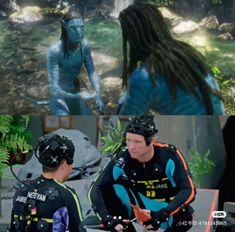 two people in scuba suits standing next to each other and one person with dreadlocks on