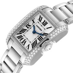 Cartier Tank Anglaise White Gold Diamond Ladies Watch WT100008. Quartz movement. 18k white gold case 30.2 x 22.7 mm. Circular grained crown set with an original Cartier factory diamond. 18k white gold original Cartier factory diamond bezel. Scratch resistant sapphire crystal. Flinque and silvered dial with black Roman numerals. Sword shaped blued steel hands. Secret Cartier signature at X. 18k white gold bracelet with hidden butterfly clasp. Fits 6" wrist. Cartier Diamond Watch For Wedding With Polished Finish, Classic Platinum Diamond Watch With Brilliant Cut, Classic Cartier Jewelry With Diamond Hour Markers, Cartier Designer Diamond Watch, Luxury Cartier Diamond Watch For Anniversary, Designer Cartier Diamond Watch, Designer Diamond Cartier Watch, Cartier Diamond Watch For Wedding, Classic Silver Diamond Watch With Diamond Hour Markers