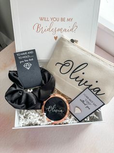 the bridesmaid gift box is filled with personal items