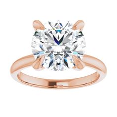 a rose gold engagement ring with a round cut diamond