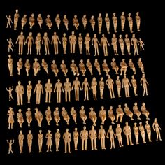 an assortment of wooden figurines are displayed on a black background in this image