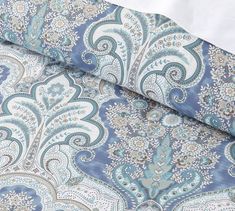 a blue and white paisley print fabric