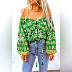 Bohemian Printed Tassel Tie Blouse! Designed With A Free-Spirited, Fun Touch, This Blouse Is Sure To Make An Impression Anywhere. It Features An Absolutely Dazzling Off-Shoulder Neckline, With A Drawstring Closure For That Perfect Fit. Long Balloon Sleeves Create An Elegant Silhouette, And The Floral Pattern Is Oh-So Chic. Add A Touch Of Boho Flair To Your Everyday Wardrobe With This Beautiful Boho Blouse You Won't Regret It! Pet Free/Smoke Free Home. Green Bohemian Tops For Vacation, Bohemian Long Sleeve Blouse With Back Tassel Tie-up, Bohemian Cotton Blouse With Back Tassel Tie-up, Bohemian Blouse With Tassel Ties For Beach, Bohemian Blouse With Tassel Ties For Festivals, Green Bohemian Peasant Top For Vacation, Green Summer Peasant Top For Beach, Green Bohemian Peasant Top For Beach, Green Bohemian Peasant Top For The Beach