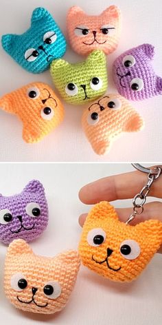 four different colored cats keychains with eyes on each one and the other side