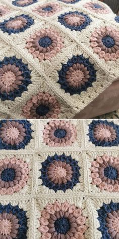 crocheted granny blanket with blue, pink and white flowers on it sitting on top of a bed