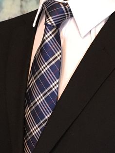 "For the man who loves plaid, Ed's Neckties offers this 100% silk mens plain necktie. Features a navy blue background with blue, gray and red plaid pattern. Available as a extra long tie. Handmade from 100% silk, this special collection features a .75\" Eds Neckties logo at the bottom right front corner of every tie and a larger logo located on the tipping (Back of the tie). The label features the collection name (Nathaniel Alexandria) Named after my son Nathaniel and my daughter Alexandria. Exp Make A Tie, Plaid Tie, Tie Men's, Navy Blue Background, Suit Shirts, Current Styles, Mens Plaid, Men's Wear, Men's Suits