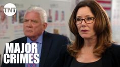 a man and woman standing next to each other in front of a whiteboard with the words major crimes on it