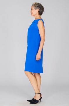 An essential silk sheath dress with a flattering high neckline. Unlined and finished with a simple back zip closure. Sleek Dresses With Back Zipper For Spring, Sleek Spring Dresses With Back Zipper, Sheath Midi Dress With Pleated Back For Work, Elegant Daywear Dress With Back Zipper, Elegant Knee-length Shift Sleeveless Dress, Modern Work Dress With Back Zipper, Modern Workwear Dress With Back Zipper, Sleek Knee-length Dress With Back Zipper, Silk Sleeveless Dress For Work