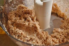 a food processor filled with oatmeal and milk