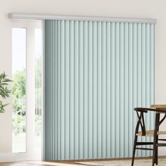 a dining room with a table and chairs next to sliding glass doors that have vertical blinds on them