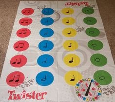 a sheet of paper that has music notes on it and the words twister written in different colors