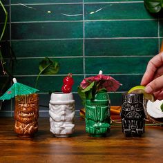 A TROPICAL TWIST ON GALACTIC FAVORITES Celebrate the Star Wars saga with this Geeki Tikis Mini Muglet Set to satisfy your thirst for epic space adventure. Whether you're on the side of the evil Empire, fighting with the Rebellion, or a bounty hunter with your own agenda, there's something in this drinkware set for everyone. Each mini figural tumbler reimagines a classic Star Wars character with a unique tropical design. Refreshing sips await you with Boba Fett, Chewbacca, Darth Vader, and an Imperial Stormtrooper. EXCITING DRINKWARE FOR YOUR CORNER OF THE GALAXY From the frigid ice world of Hoth to Bespin's floating Cloud City, this set of four mini muglets will keep you refreshed wherever your journey takes you in the galaxy. Whether you're dealing with troublesome Imperial forces or thos Shrek Character, Tiki Culture, Christmas Story Leg Lamp, Imperial Stormtrooper, Harry Potter Marauders Map, Leg Lamp, Tiki Lounge, Classic Star Wars, Evil Empire