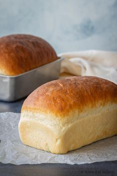 two loafs of bread sitting on top of a table