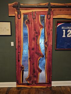 Bring a touch of natural elegance and artistry to your home with my Live Edge Cedar Door. This isn't just any door--it's a striking feature that will set your space apart. Each door is crafted with care, blending the rugged beauty of cedar with a smooth hand-forged epoxy resin finish and intricate wrought iron accents. This wooden door offers a perfect mix of rustic charm and modern style. Picture a door that highlights the unique contours of live edge wood, finished with sleek epoxy resin and adorned with timeless wrought iron details. Whether you're updating your home or adding a standout feature, my Live Edge Cedar Door is designed to catch the eye and add a touch of sophistication. This interior door is ideal for anyone looking for a distinctive and stylish addition to their home decor Cedar Projects, Farmhouse Fireplace Decor, Cedar Door, Cedar Furniture, Rustic Cabins, Barn Door Designs, Outdoor Pavilion, Iron Accents, Wood Shop Projects