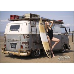 a woman in a bathing suit holding a surfboard next to an old vw bus