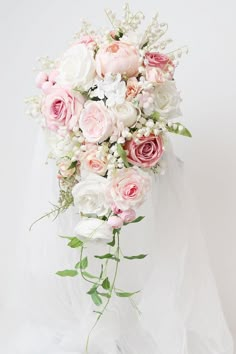 a bridal bouquet with pink and white flowers