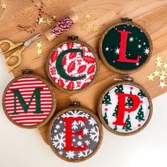 four christmas ornaments with the letter l on them