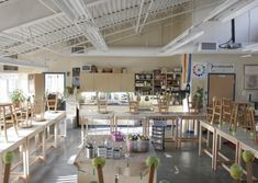 an empty room with tables and chairs in it