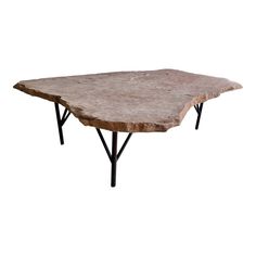 a stone table with black legs on a white background