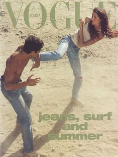 a magazine cover with a man and woman dancing on the beach in front of each other